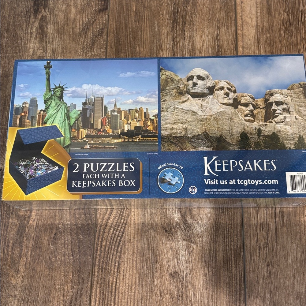 Statue of Liberty and Mount Rushmore 500 piece puzzles with keepsakes box.